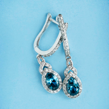 Ma. Metal Earring with Topaz